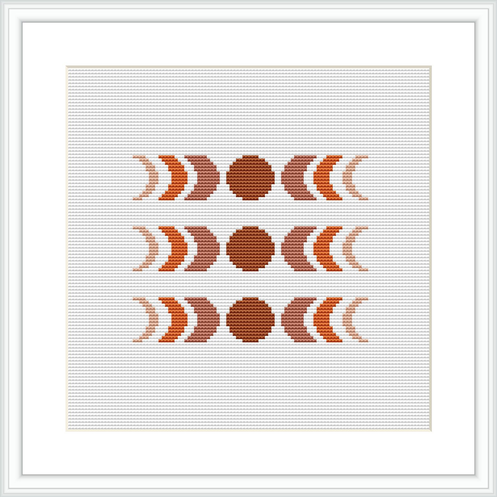 The image shows an abstract cross-stitch pattern comprised of circular and crescent shapes in a symmetrical arrangement. The design uses earthy brown and beige tones, centralized on a squared canvas, framed by a simple white border.