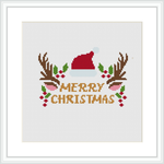 The scene shows a cross stitch pattern with 'Merry Christmas' text in the center, flanked by two reindeer antlers, a Santa hat resting on the 'M' and holly berries & leaves interspersed.