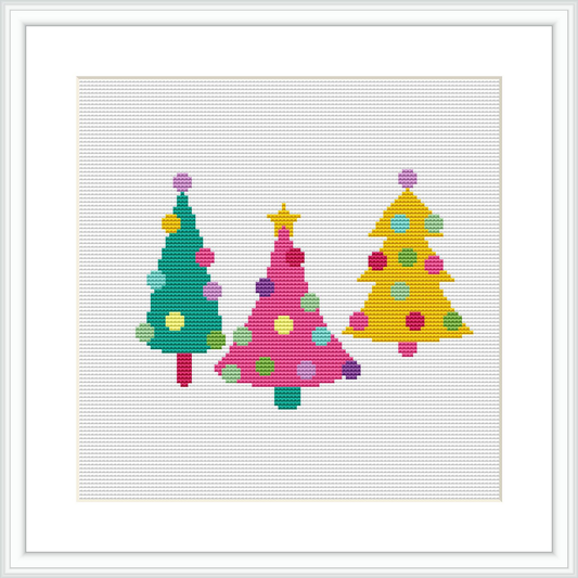 The image features three stylized Christmas trees arranged in a row, each with a unique color scheme and decorated with colored baubles, on a white background within a square frame.