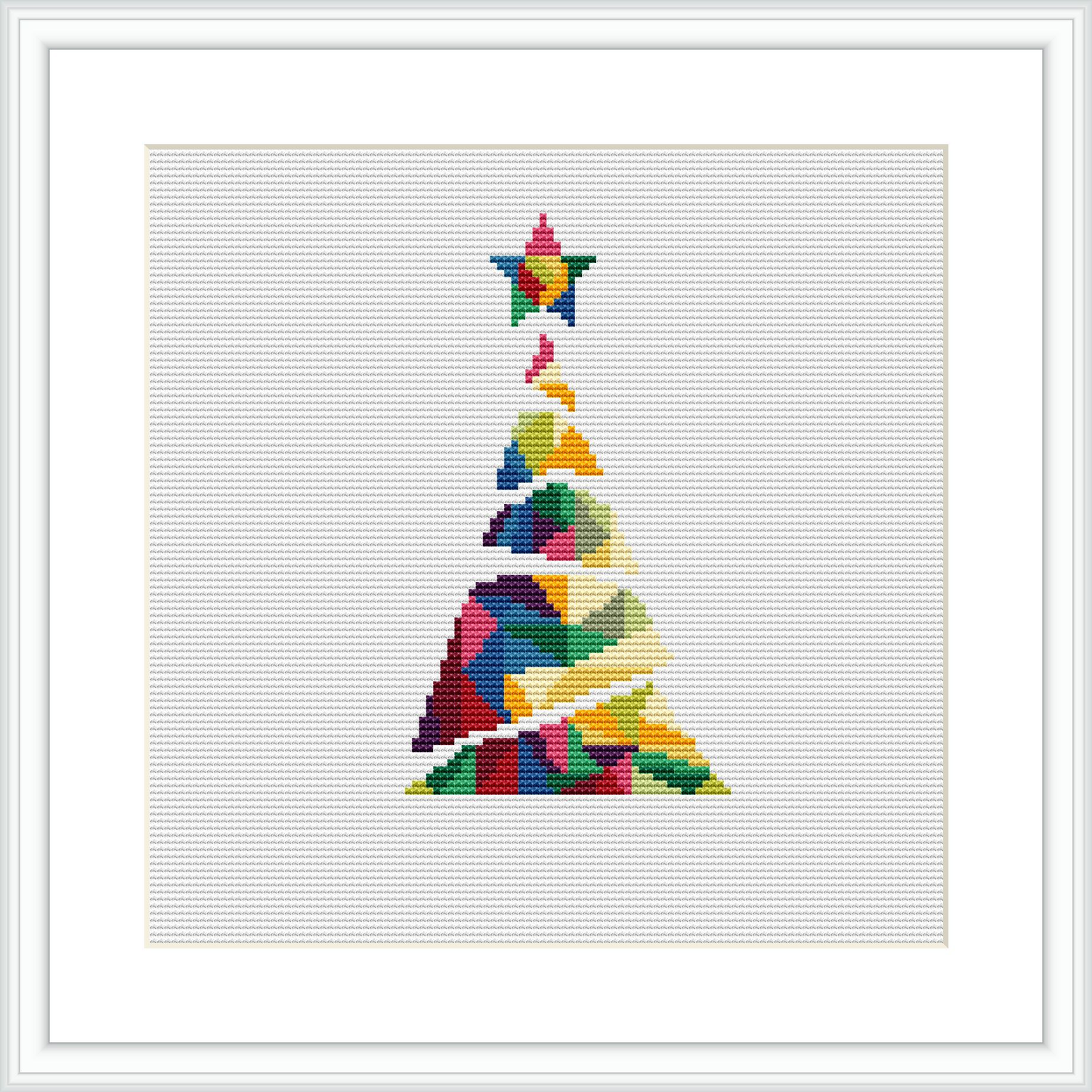 The image shows a cross stitch pattern of a geometric Christmas tree. The tree consists of different colorful shapes against a white background, framed by a simple black border.