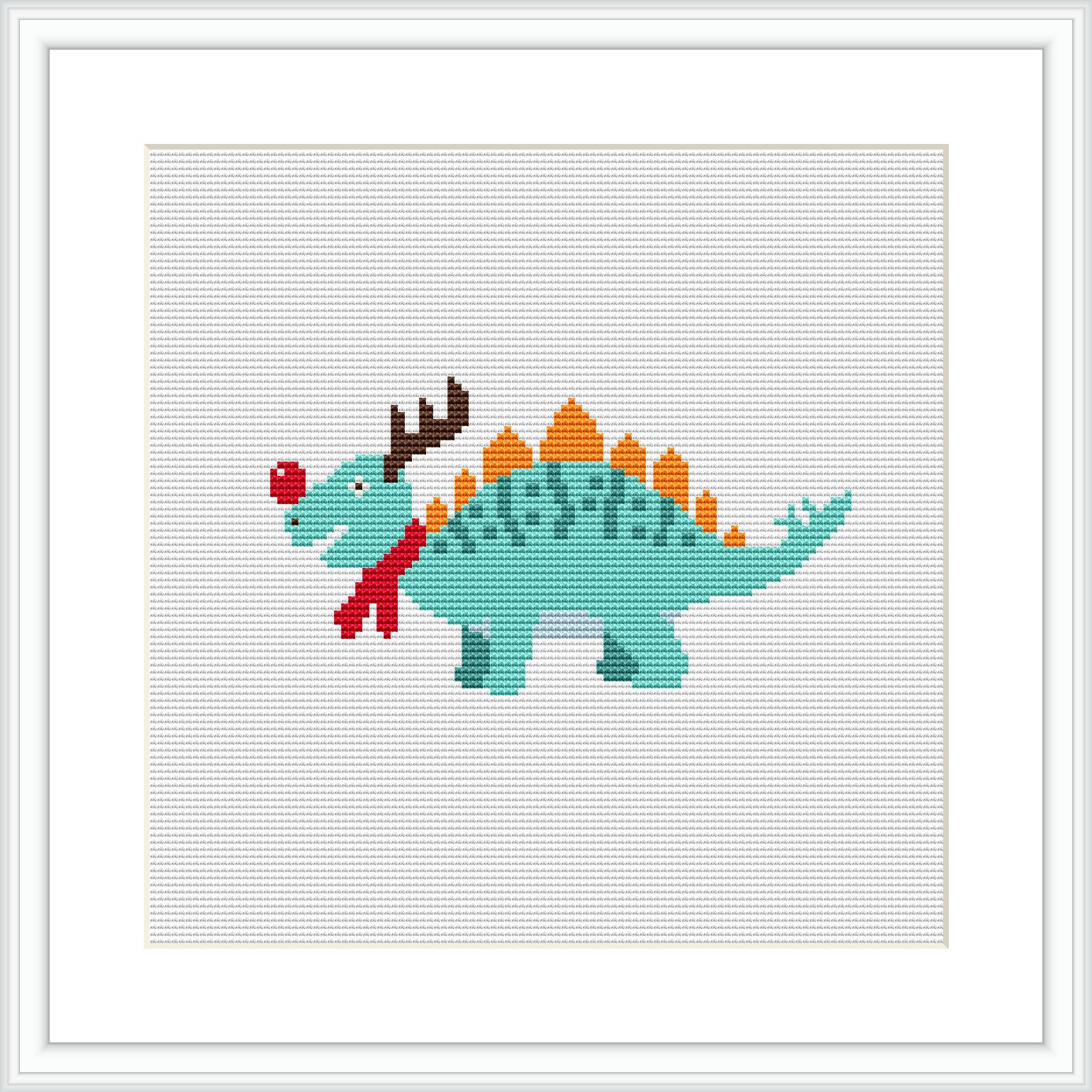 The image depicts a cross-stitch pattern of a green dinosaur with a red scarf and what appears to be reindeer antlers, embellished with decorative Christmas-themed patterns.