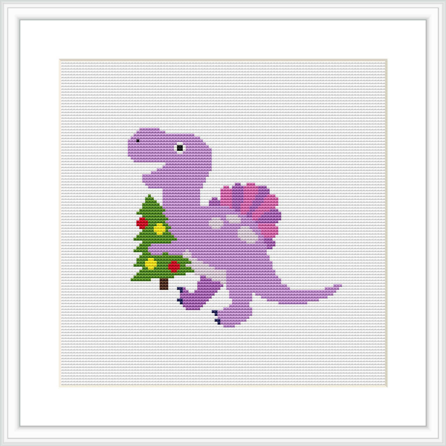 The image depicts a framed cross stitch pattern featuring a cartoon-style purple dinosaur holding a small, decorated green Christmas tree. The background is blank, which emphasizes the stitched figure.