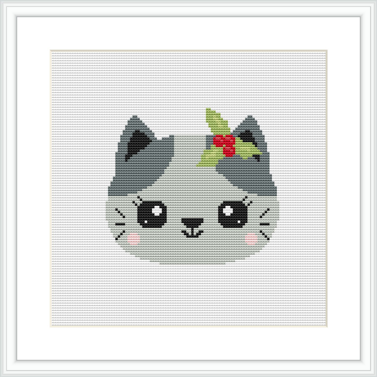 This cross stitch pattern depicts a grey cat with big, round eyes and prominent whiskers. The cat is accessorized with a small, red and green holly plant atop its head.