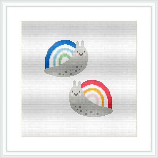 The image showcases a framed cross stitch pattern featuring two snails, each with a rainbow-colored shell, placed side by side against a white background within the pattern area.