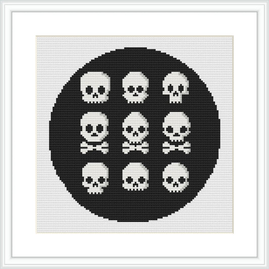 The image presents a cross stitch pattern featuring nine symmetrical skeletons arranged in a circle on a solid black background, within a circular boundary, and framed with a simple white border.