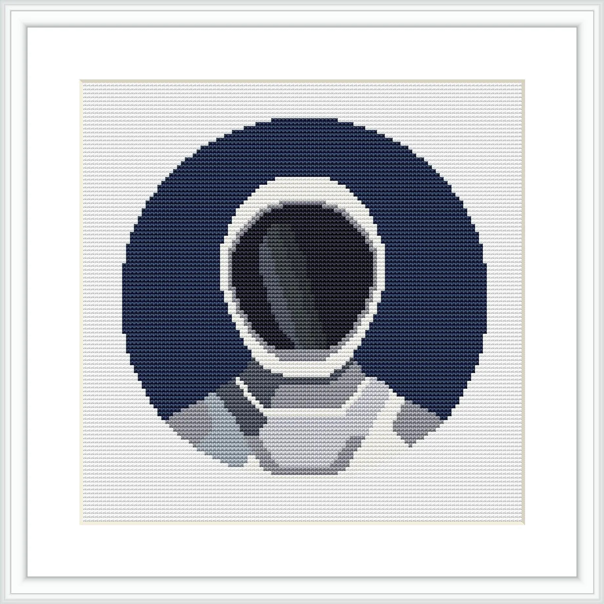 The image features a cross stitch pattern of an astronaut in a space suit against a dark blue circular background, representing space. The astronaut is centered, facing forward, with the helmet visor reflecting the void of space.