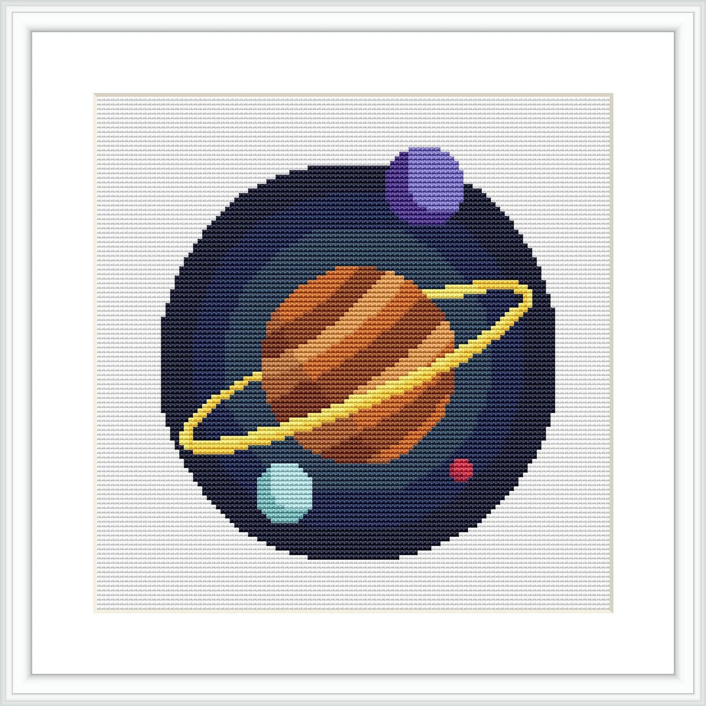 The image depicts a cross stitch design of a stylized solar system with variously sized and colored planets against a dark blue background dotted with smaller stitch 'stars'.