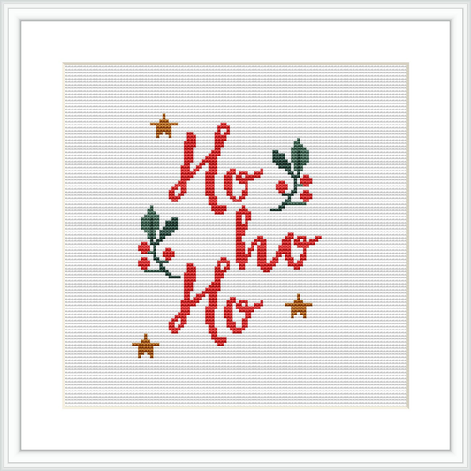 The image features a cross stitch pattern with the words 'Ho ho ho' in red, adorned with green holly leaves and berries, and accented with golden stars, all framed against a white background within a simple square frame.