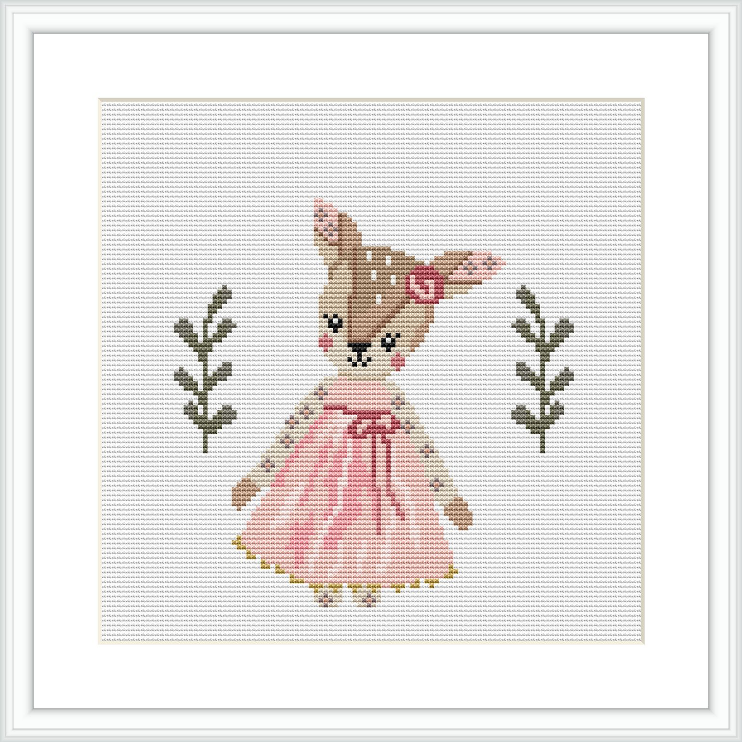 The image displays a cross stitch pattern featuring a deer in a pink dress standing upright with a small floral motif on either side all against a white background.