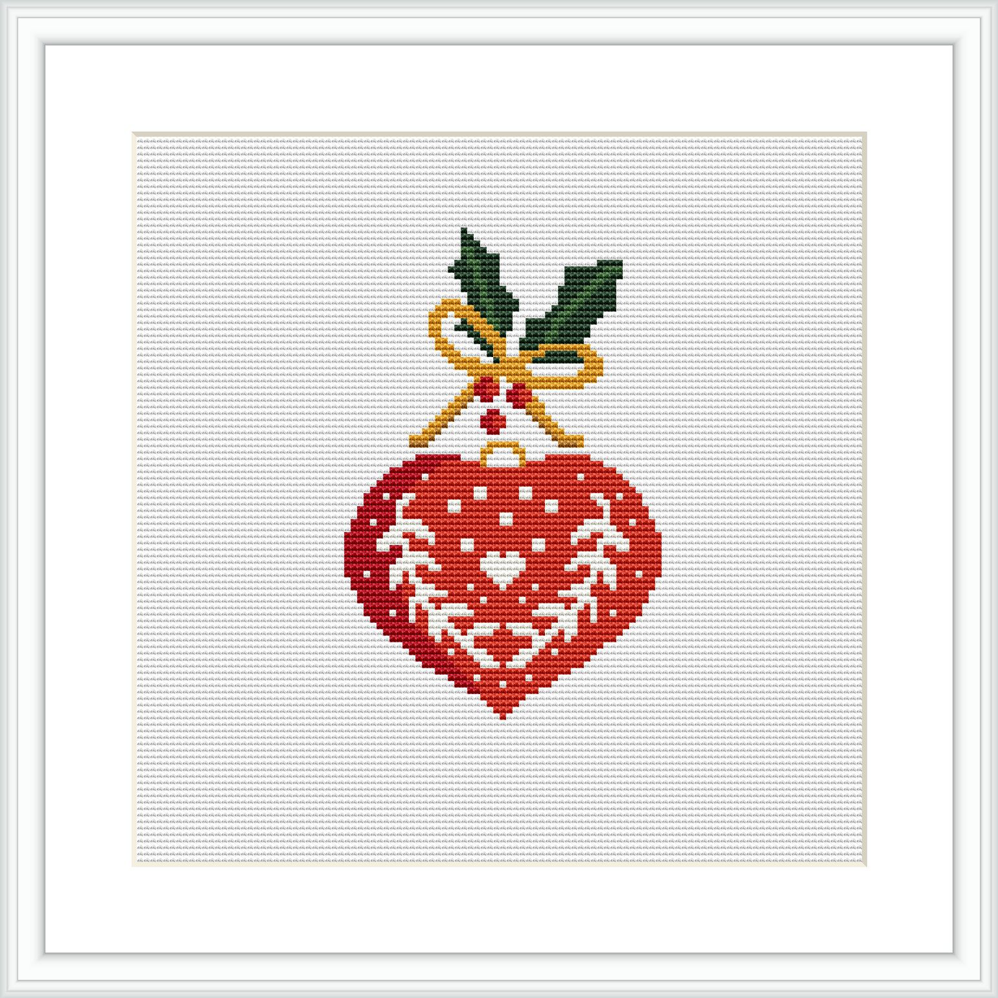 The image features a cross-stitch pattern consisting of a centrally placed heart-shaped ornament with a Nordic-inspired design, mainly in red and white. Two green leaves and a yellow ribbon are at the top, giving the impression of a Christmas decoration. The heart is framed within a white square canvas, further enclosed in a simulation of a simple flat frame.