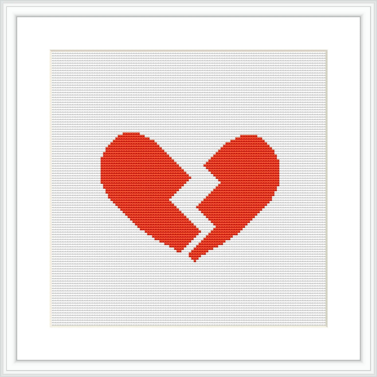 The image showcases a cross stitch pattern of a broken heart, centered on a white canvas, framed in a minimalist style with a simple black frame.