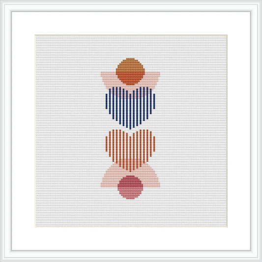 The image shows a framed cross stitch pattern consisting of three stacked abstract hearts. Each heart consists of horizontal stripes in various colors, with a solid colored circle in the center. The colors alternate between blue and red for the stripes, with pink and brown for the central circles. The design is centered on a white canvas within a square frame.