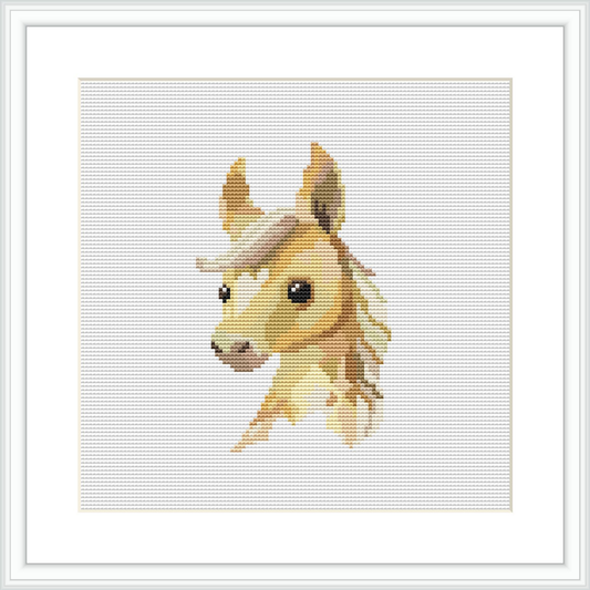 The image shows a cross stitch pattern of a horse's head and neck. The horse is facing the viewer, depicted in shades of brown and beige against a white background. The pattern is framed by a simple white border.