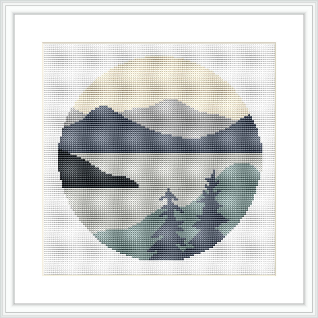 A round cross stitch pattern depicting a minimalist landscape of mountains and foreground trees, placed against a segmented circle background representing the sky.