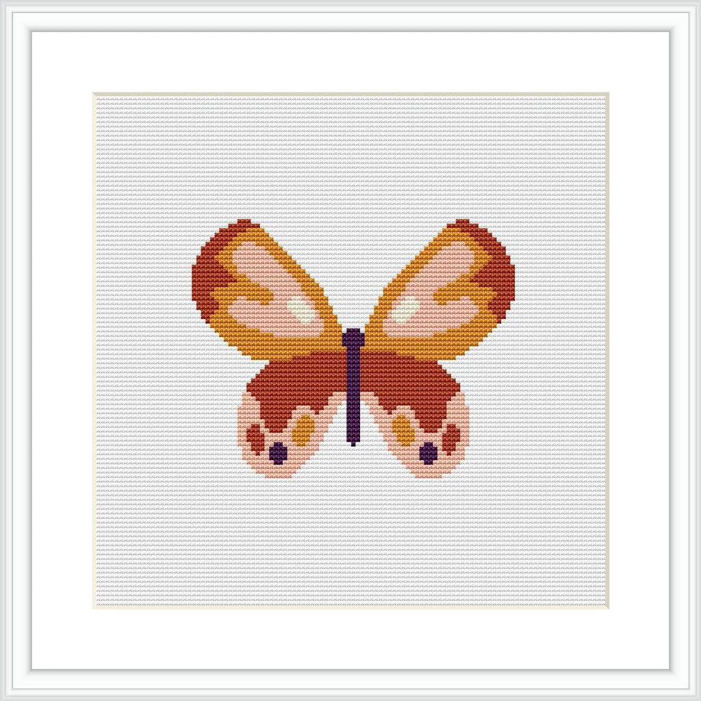 The image shows a framed cross stitch pattern of a stylized butterfly centered on a white canvas, with a color palette consisting of pastel pinks, oranges, yellows, and browns.