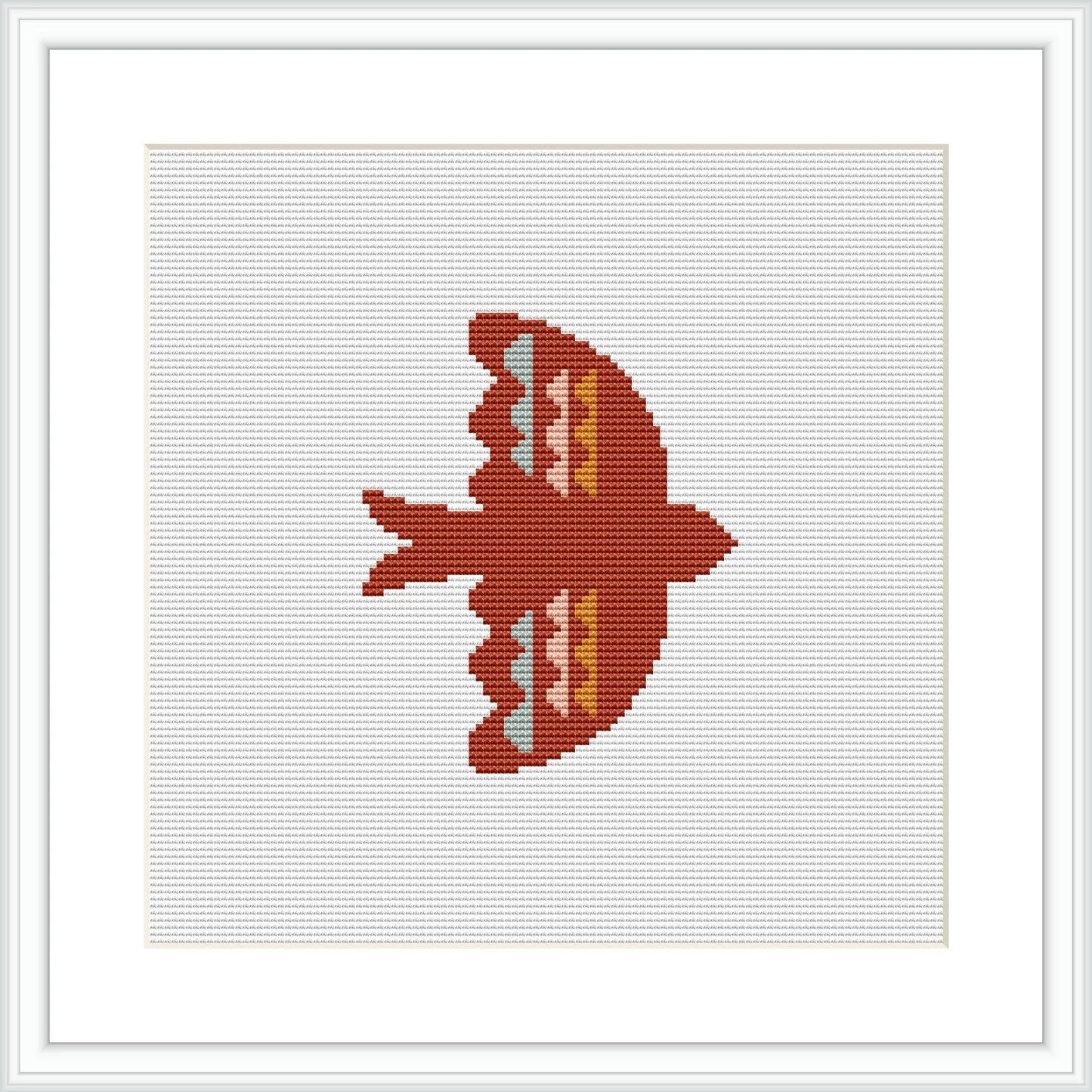 The image displays a cross stitch pattern of a bird silhouette in red, coral, and peach tones against a white background, framed in a simple white frame, suggesting a minimalist and symmetrical design.