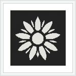 The image depicts a black and white cross stitch pattern of a symmetrical floral design with a central circle surrounded by elongated petal-like shapes. It is placed within a square frame against a black background.