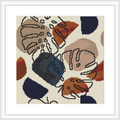 The image showcases a framed cross stitch pattern featuring abstract shapes and monstera leaves in a nature-inspired palette. The design is stitched on a neutral fabric and framed in a simple white frame.