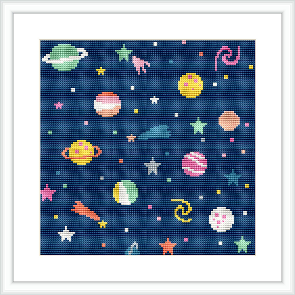 The image depicts a cross stitch pattern with a variety of planets and celestial bodies, including stars and galaxies, set against a dark navy blue background, resembling a night sky.