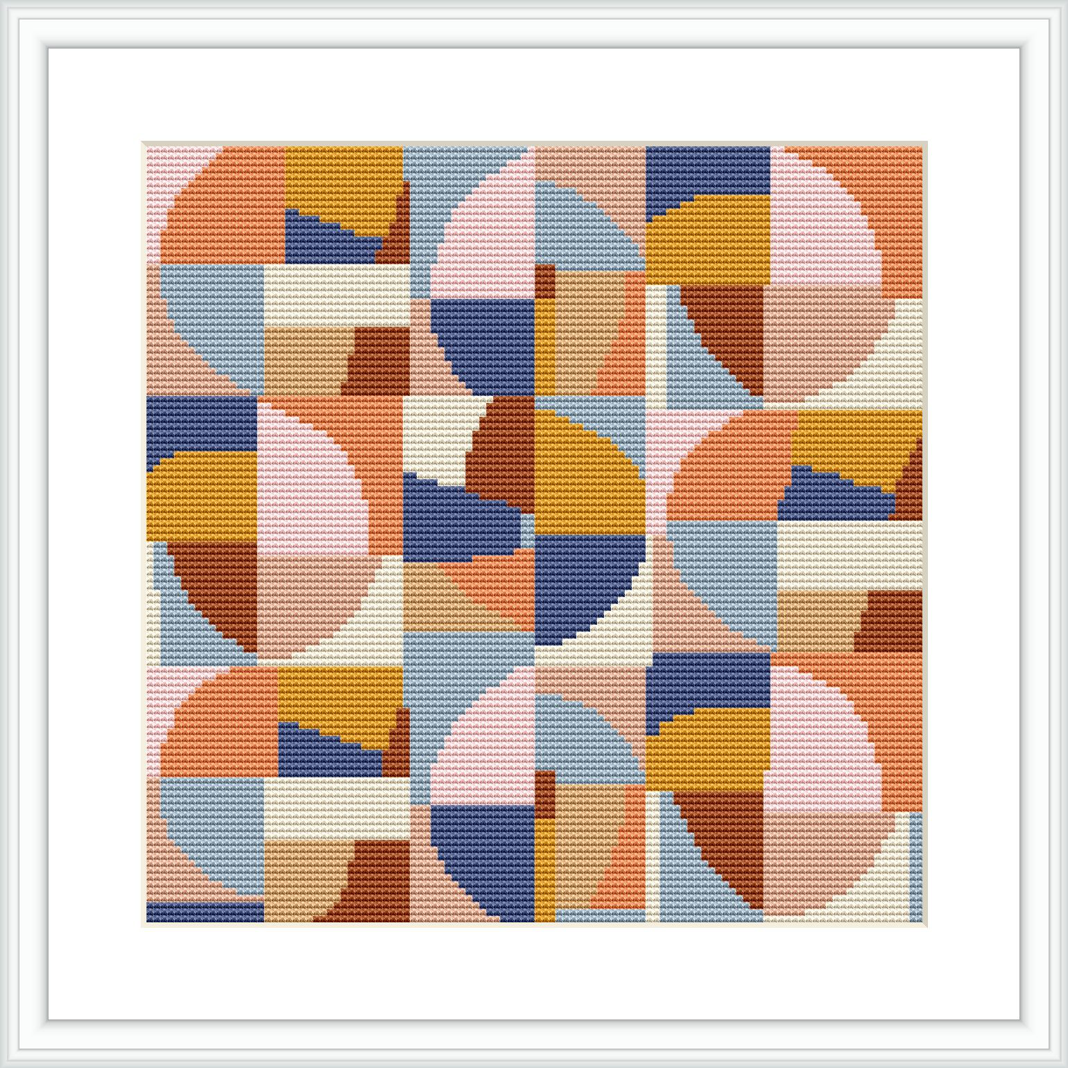 Cross stitch pattern framed in a simple white frame, featuring an abstract geometric design with overlapping circles and squares in a palette of muted warm colors.