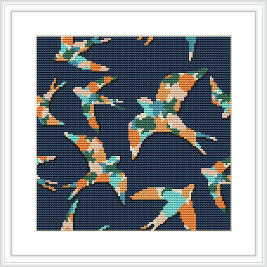 The image displays a cross stitch pattern depicting several swallows in various positions of flight against a dark navy blue background. Each bird is rendered in shades of teal, coral, peach, and mint. The design is contained within a white frame.