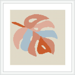 The image shows a framed cross stitch pattern featuring the stylized image of a monstera leaf. The leaf is rendered in shades of pink and blue on an ivory fabric background. The overall design is simple yet captures the essence of the tropical plant.