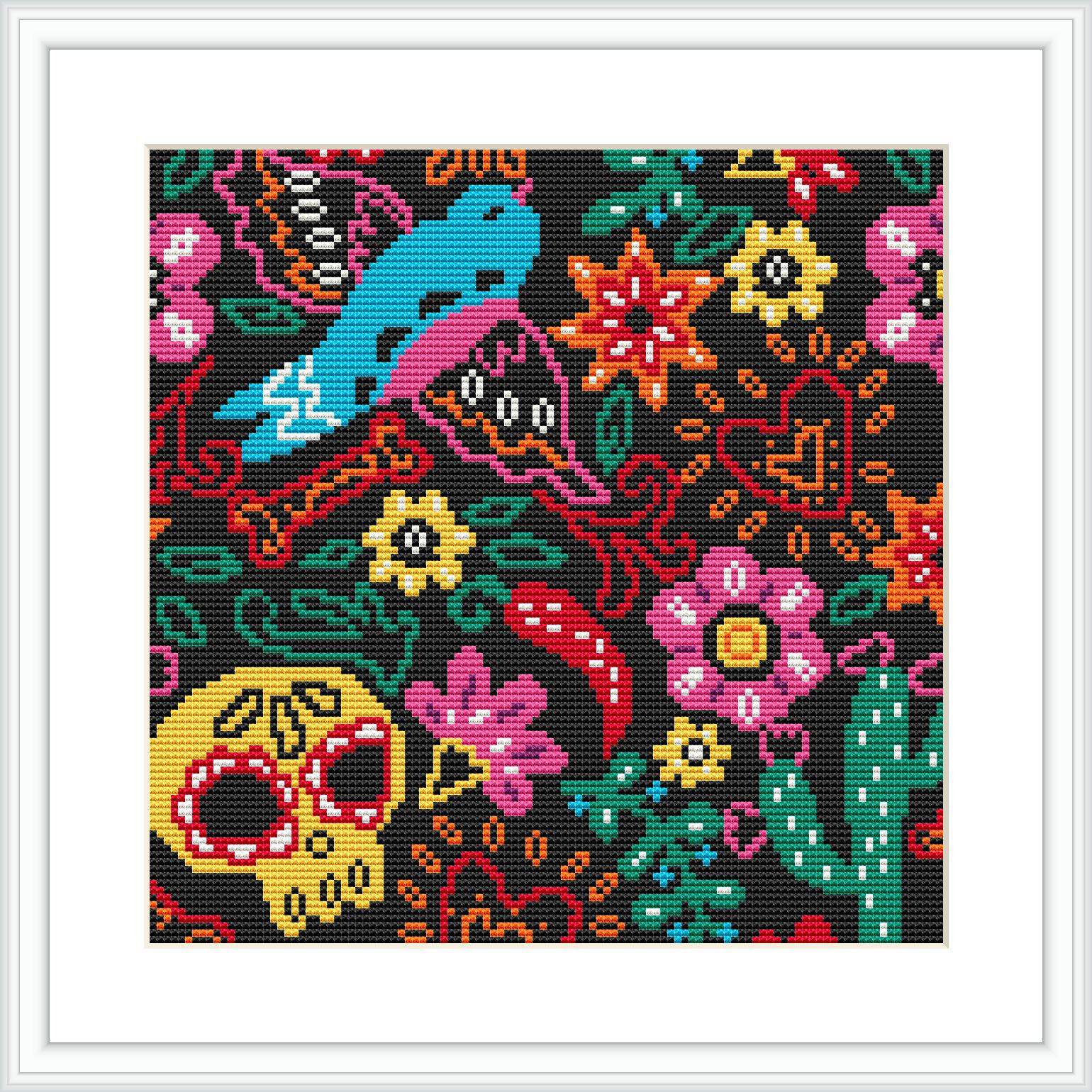 A framed cross stitch pattern featuring Mexican-inspired motifs such as a brightly colored bird, flowers, and a sugar skull on a black background.