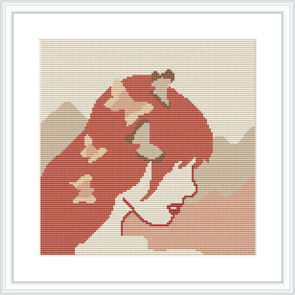 The image features a cross-stitch pattern of a woman in profile with butterflies, framed with a wide border, against a beige fabric background.