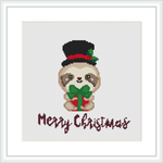 The image depicts a cross stitch pattern of a sloth dressed in a black top hat with a red band and a green Christmas bow, holding a candy cane. Below the sloth is the embroidered text 'Merry Christmas' in red.