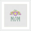 The image contains a cross stitch pattern featuring the word 'MOM' in green letters at the bottom, with a decorative floral arrangement above it showcasing a bouquet with purple and yellow accents on a white background.