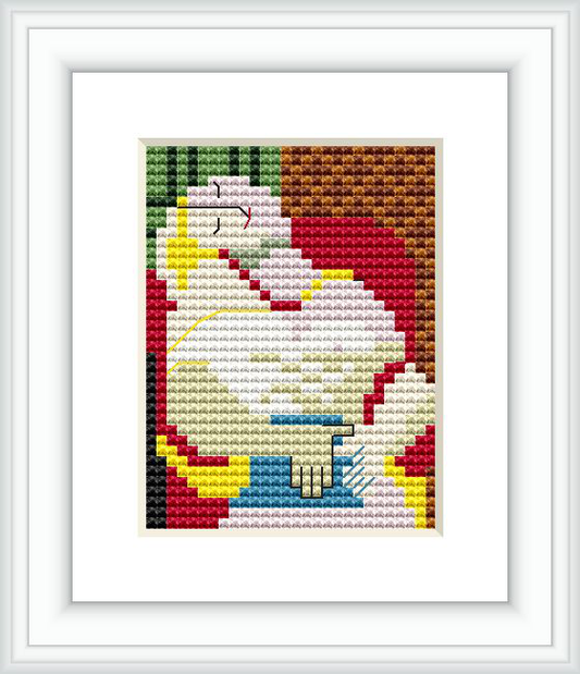 The image showcases a framed cross stitch pattern representing an abstract cubist-style portrait, dominated by shapes and colors rather than defined forms, inspired by Picasso's artwork 'The Dream'.