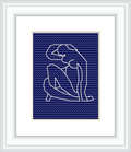 The image displays a framed cross stitch pattern of Matisse's Blue Nude II, against a white background. The embroidery features the outline of a seated nude figure, in white against a solid blue background, encased within a simple white frame.