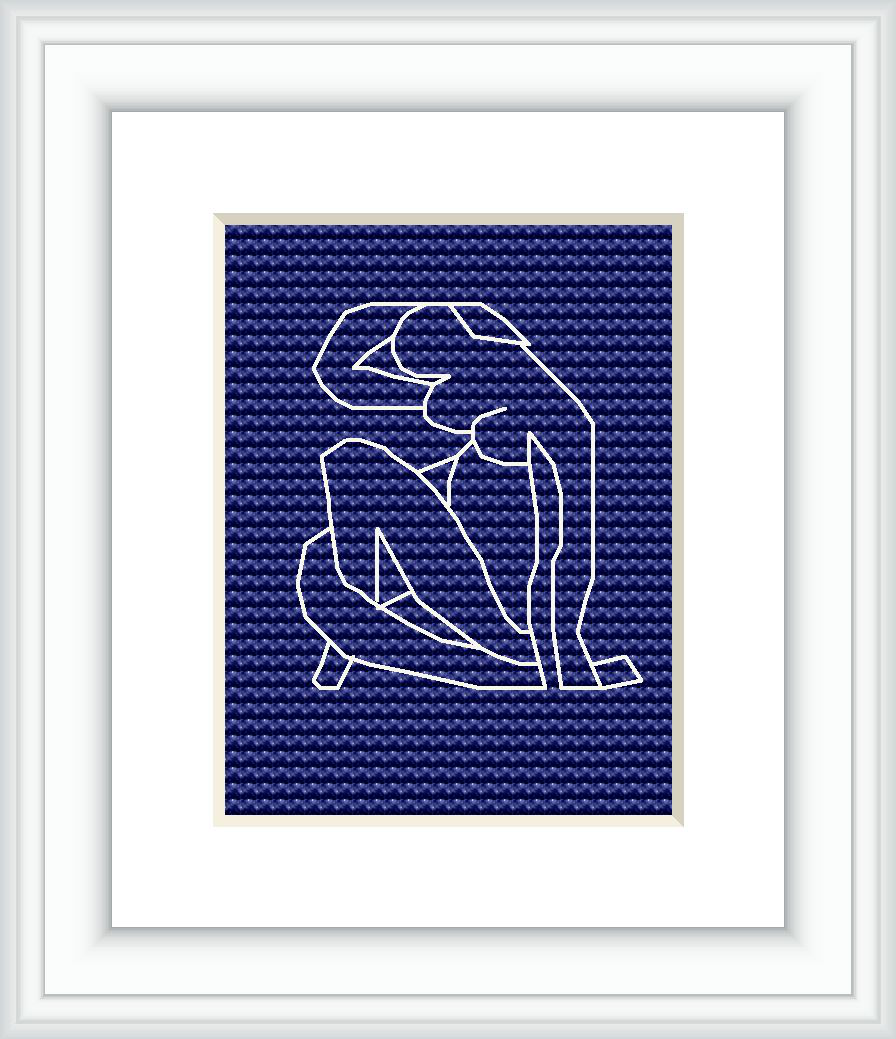 The image displays a framed cross stitch pattern of Matisse's Blue Nude II, against a white background. The embroidery features the outline of a seated nude figure, in white against a solid blue background, encased within a simple white frame.