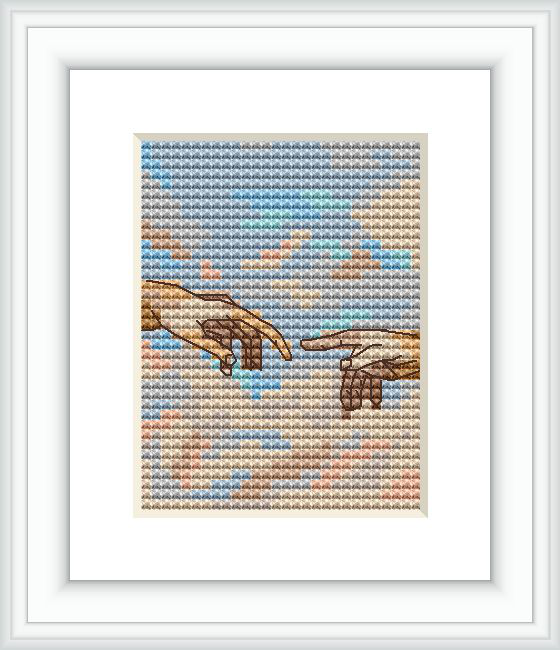 The image shows a cross stitch pattern framed in white depicting two hands nearly touching, mimicking Michelangelo's 'The Creation of Adam'. The background consists of various pastel colors approximating the appearance of clouds or sky.