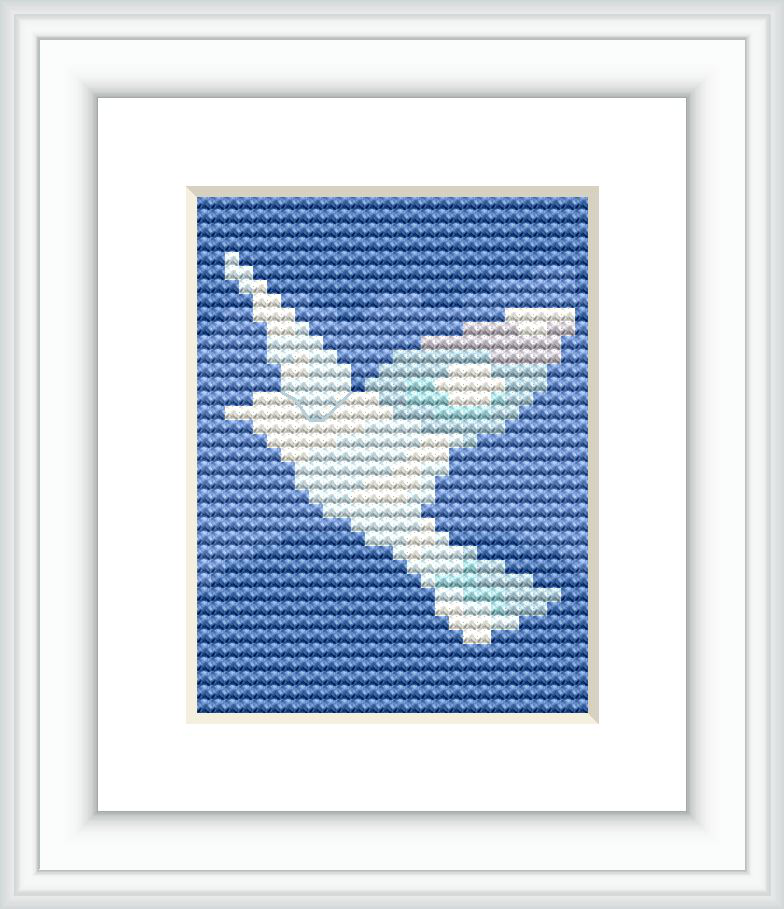 The cross stitch pattern depicts the silhouette of a bird in flight against a blue backdrop with a gradient effect transitioning from light at the bottom to dark blue at the top.