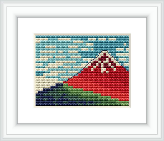 This is a framed cross stitch pattern depicting Mount Fuji as seen from a distance with stratified colors representing the famous woodblock print by Hokusai.