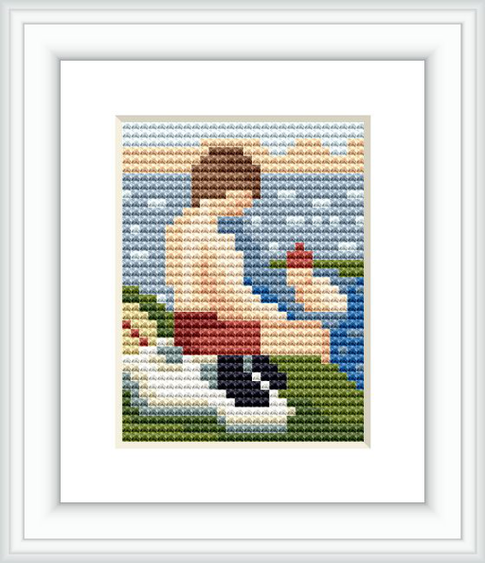 The image shows a cross stitch pattern depicting a person seated by a body of water, facing away from the viewer, with water, sky, and vegetation in the background.