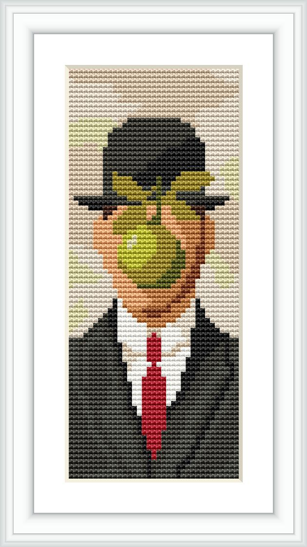 The image features a pixelated cross stitch pattern of a man in a suit with his face obscured by a floating green apple. The background is a of muted beige.