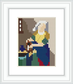 The image shows a cross stitch pattern framed in white. The design portrays a woman, likely in a domestic setting, focused on her task which appears to be pouring milk or engaging in kitchen work. The pattern is stitched with a variety of colors creating shading and depth.