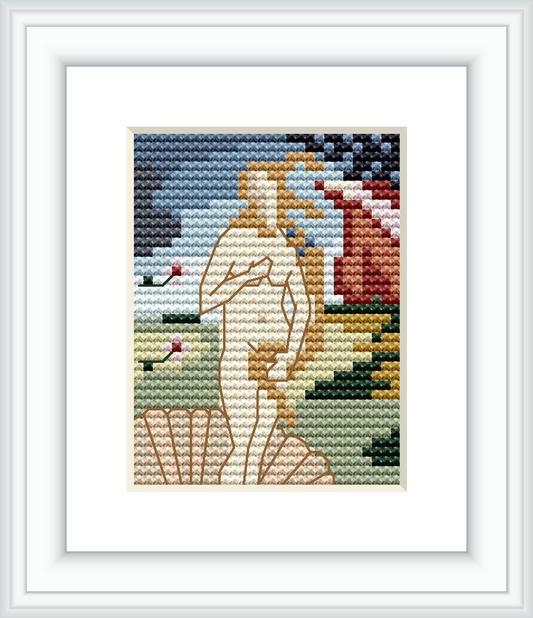 The image depicts a framed cross stitch pattern resembling 'The Birth of Venus' by Sandro Botticelli. The pattern showcases a stylized version of Venus standing on a sea shell against a backdrop of sea and sky.