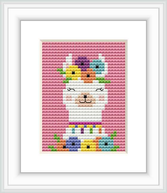 The image shows a framed cross stitch pattern with a colorful, stylized depiction of a llama. The llama is created with an array of pastel and bright colors, arranged in sections throughout its body, with a white background. The pattern is enclosed within a white square frame against a light-colored backdrop.