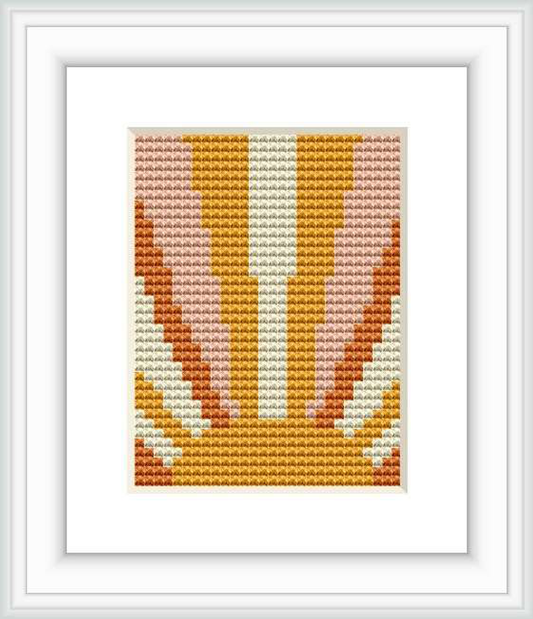 The image showcases a framed cross stitch pattern depicting an abstract sunrise design with segmented colors creating a gradient effect resembling the morning sun rising over the horizon.