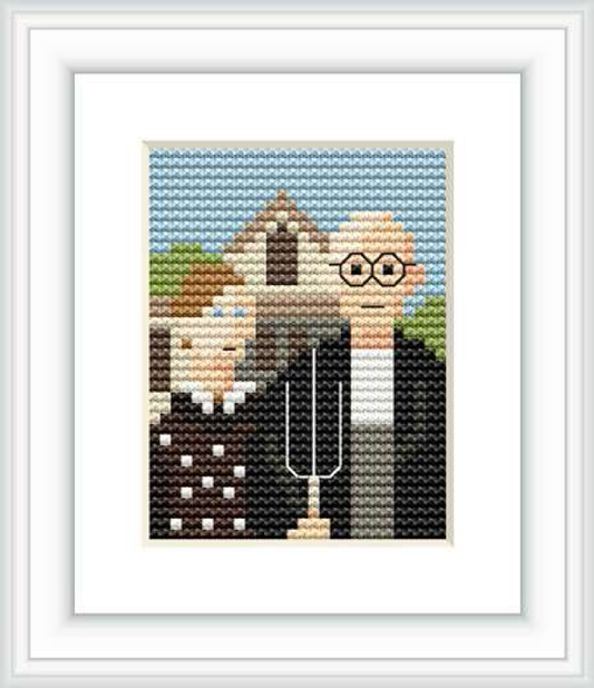 The image shows a framed cross stitch pattern resembling the 'American Gothic' painting. There are two figures, a man holding a pitchfork, and a woman, with a farmhouse in the background. The pattern is set against a blue sky.