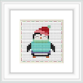 The image showcases a cross stitch pattern featuring a stylized penguin with a red and green holiday hat. The penguin is centered on a white fabric with a grid pattern, framed in a white square frame.