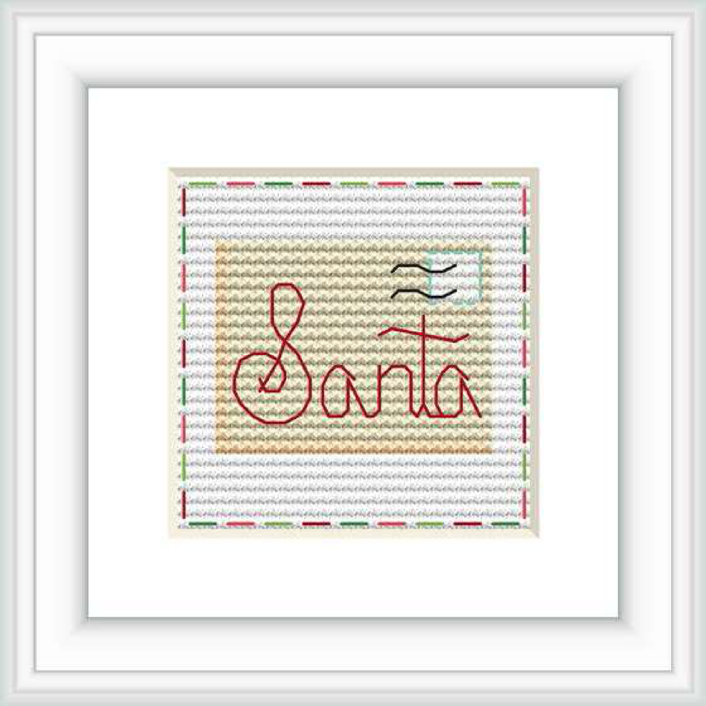 The image shows a cross stitch design featuring the word 'Santa' in red cursive lettering centered on a beige background with a subtle gray postmark above and to the right. The work is framed within a square that has a double layered border, the outermost being red and the inner one green.