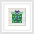 This is a framed cross stitch image depicting a stylized wrapped gift with a bow, primarily in green and purple hues. It's set on a white background with red and grey decorative stitches around the border.