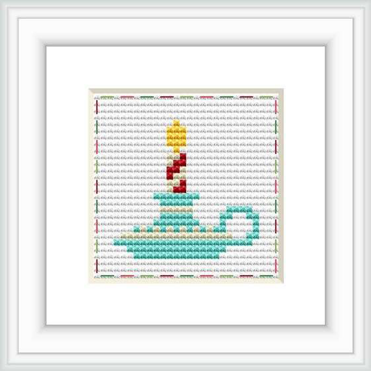 The image features a framed cross stitch pattern of a stylized candle with layers of red, yellow, and green, set against a white fabric with red-bounded edges. Stitching is on a grid with visible cross stitches.