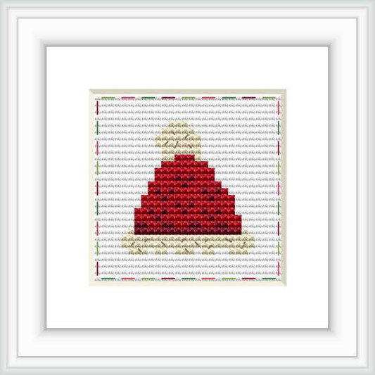 The image displays a framed cross stitch pattern of a red hat centered on an off-white canvas, surrounded by a decorative border.