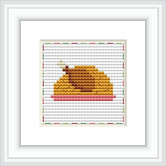 The image shows a framed cross stitch pattern featuring a stylized turkey. It is mainly composed of brown and golden hues, with touches of red and green, against a neutral background with a grid indicating the layout of stitches.