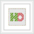 The image features a framed cross stitch pattern with the letters 'HO' centered on it. The letters are in a block style, with the 'H' in green and the 'O' in red, set against a background that fades from grey at the top to white at the bottom, with tiny red and green dots simulating a festive pattern.